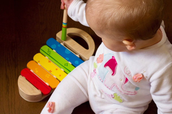 toddler playing xylophone